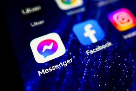 Messenger and Facebook app logos displayed on a mobile phone screen