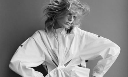 Hanne Gaby Odiele in an oversized puffy white shirt and with windswept hair