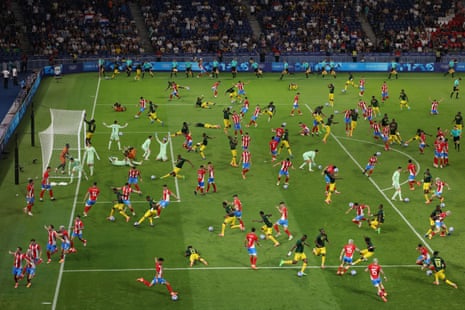 A digitally-layered composite showing various moments from the men’s group D football match between Paraguay and Mali at Parc des Princes.
