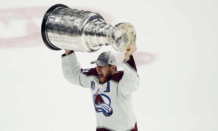 Nathan MacKinnon lifts the Stanley Cup after his team’s victory on Sunday night