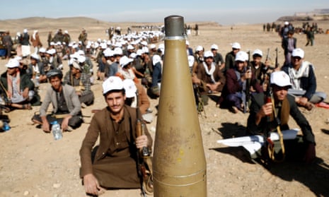 Yemen's Houthi followers take a rest ahead of taking part in a tribal rally and parade against the United States-led aerial attacks launched on sites in Yemen, and solidarity with Palestinians, on January 22, 2024, near Sana'a, Yemen.