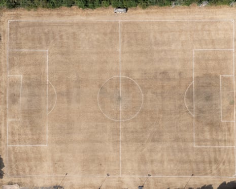 A dried-out football pitch seen from above.