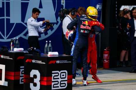 Max Verstappen embraces Lewis Hamilton.