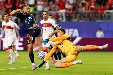 Isidro Pitta (25) and Orlando Gill (12) of Paraguay defend a shot.