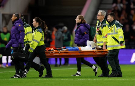 Michelle Agyemang is carried off on a stretcher