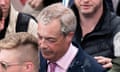 Farage with liquid on his hair, face and clothes
