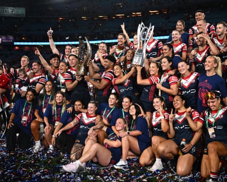 The Sydney Roosters NRL and NRLW teams celebrate their grand final wins together at Accor Stadium.