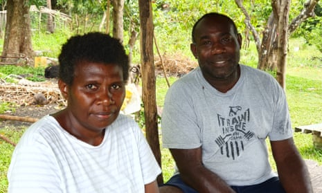 Nelly Bob Daniel, left, and Tasale Edward Bule sit together outdoors