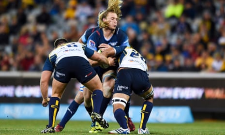 Josh Mann-Rea and Jarrad Butler of the Brumbies tackle Jacques du Plessis of the Bulls.