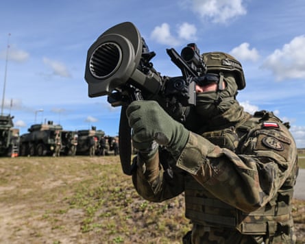 A Polish soldier aims a Swedish-designed Carl-Gustaf recoilless rifle during a static equipment presentation as a live ammunition exercise in Nowa Deba
