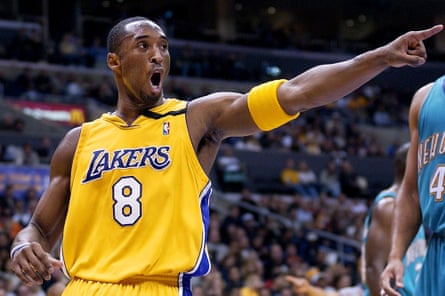 Kobe Bryant points to a teammate during an NBA basketball game in Los Angeles in 2002.