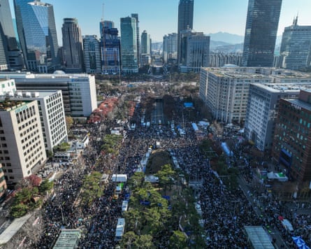 A large protest in a city seen from an aerial view