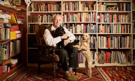 Philip Pullman photographed at home in Oxfordshire with his cockapoos, Coco and Mixie.