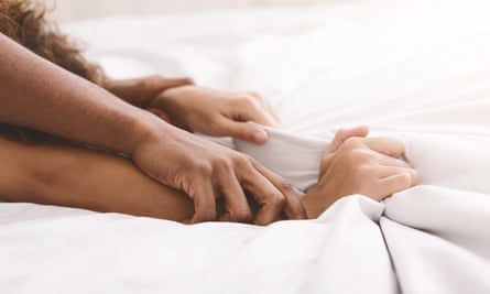 Black couple hands pulling white sheets 