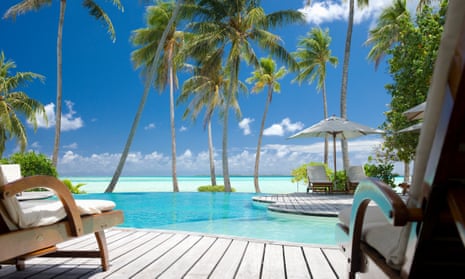 Infinity swimming pool at tropical luxury resort
