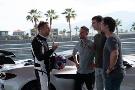 Jenson Button talks to the team.