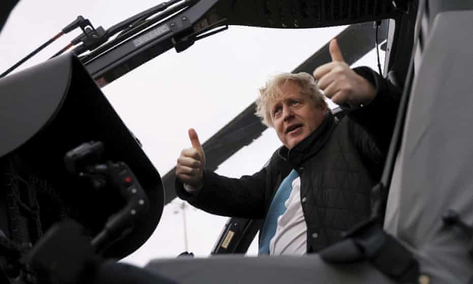 Boris Johnson gestures during a visit to RAF Valley, in Anglesey, north Wales.