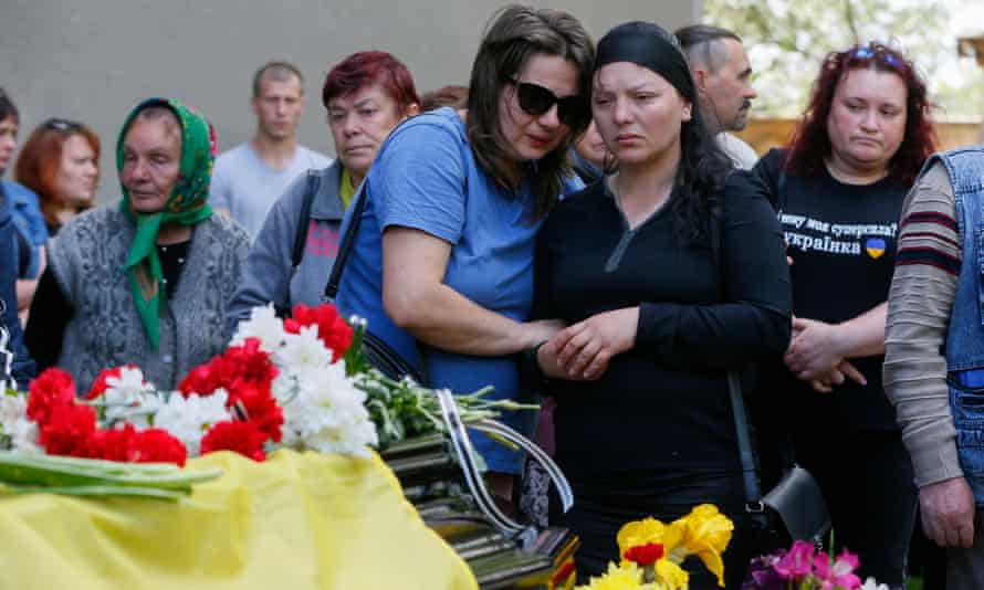 Relatives and friends attend a funeral ceremony of Ukrainian serviceman who was killed in action, in the small city of Rozdilna of Odesa region, Ukraine, 22 May 2022.