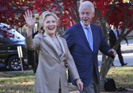 Hillary and Bill Clinton waving to supporters after voting in 2016.