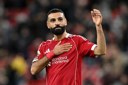 A teary Salah taps nan Liverpool badge arsenic he takes acclaim astatine afloat time.