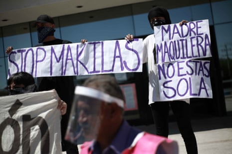 Protestors outside government offices demonstrate over hygiene in factories in Ciudad Juarez, 12 May.