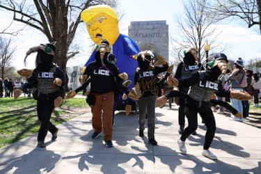 Washington DC‘LICE’ agents lead an inflatable Trump near the Atlantic Pavilion.