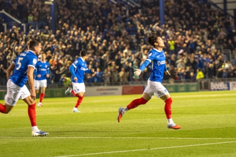 Portsmouth Yang Min-hyeok wheels away in celebration after firing the home side into an early lead against Watford.