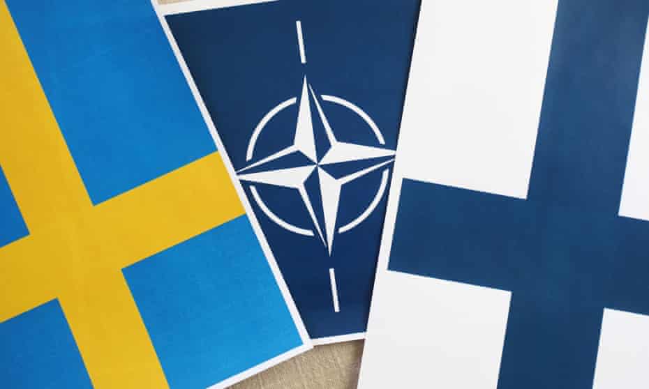 Swedish, Nato and Finnish flags.