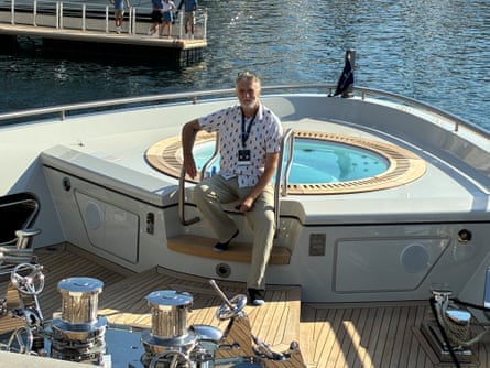 Sam Wollaston sits next to a Jacuzzi at the bow of a superyacht