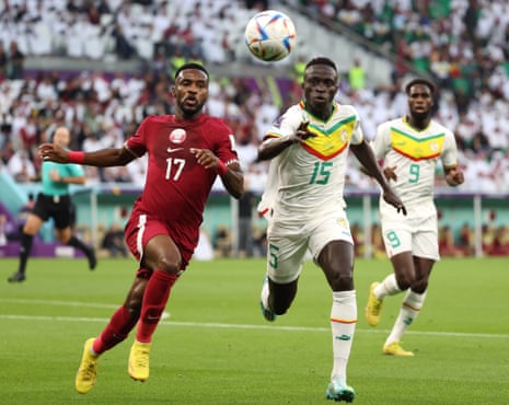 Qatar v Senegal: World Cup 2022 – live | World Cup 2022 4 Ismail Mohamad goes for the ball against Krepin Diatta.