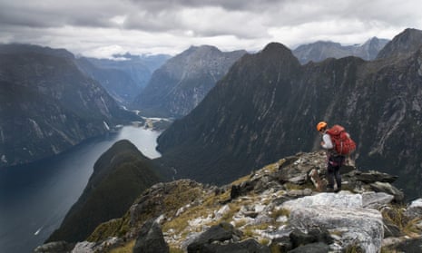 A climber on Mitre Peak escapes the buzz of helicopters, planes, tourist launches and cruise liners that fill Milford Sound.