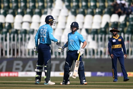 Tom Banton and Ben Duckett touch gloves celebrating fifty runs during an ODI match