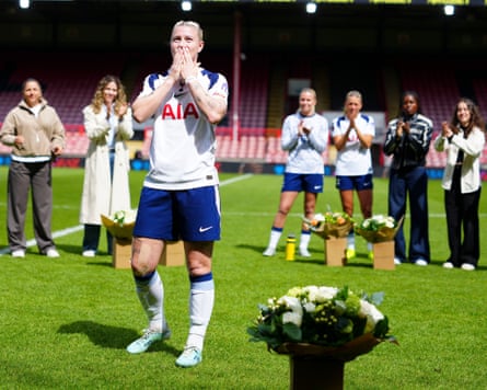 The Tottenham player Bethany England blows kisses to the crowd during a presentation to mark her departure from the club.