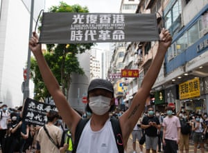 A protester holding and anti-Beijing sign