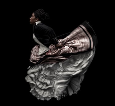 A woman running in a billowy, flowy dress against a black background.