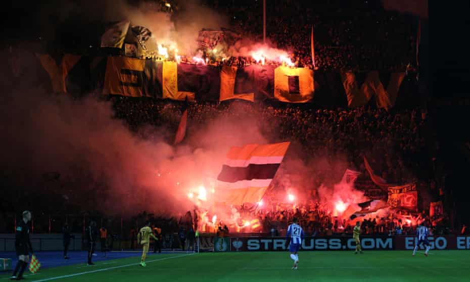 Dynamo Dresden fans show their support in a DFB Cup match against Hertha Berlin last October – the club could still play behind closed doors later this month. 