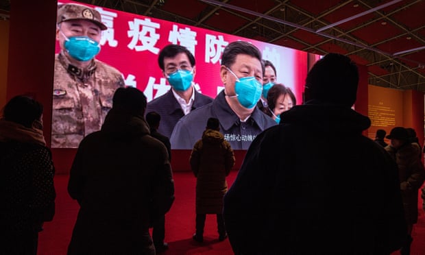 A screen showing Xi Jinping during the government-sanctioned exhibition called ‘People First, Lives First’