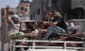 Palestinians evacuate Maghazi refugee camp in the central Gaza Strip after an Israeli evacuation order.