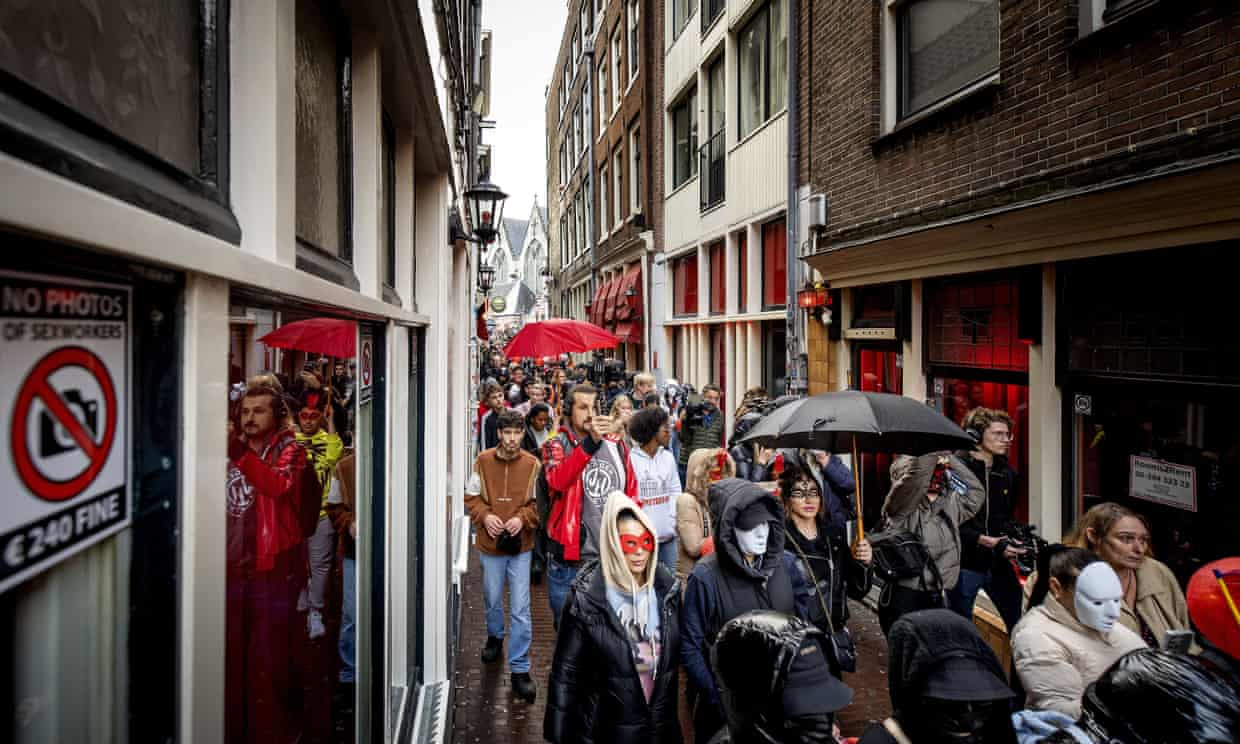 Amsterdam sex workers protest against plan to move red light district (theguardian.com)