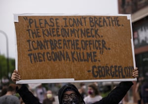 A protester holds a sign