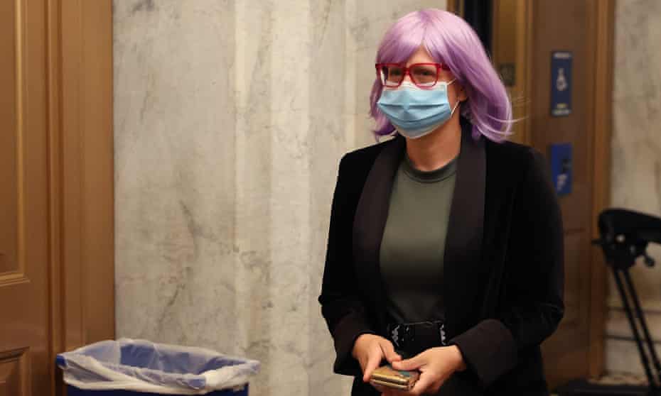 Kyrsten Sinema arrives at the US Capitol on 18 May 2020 sporting a bright purple wig.