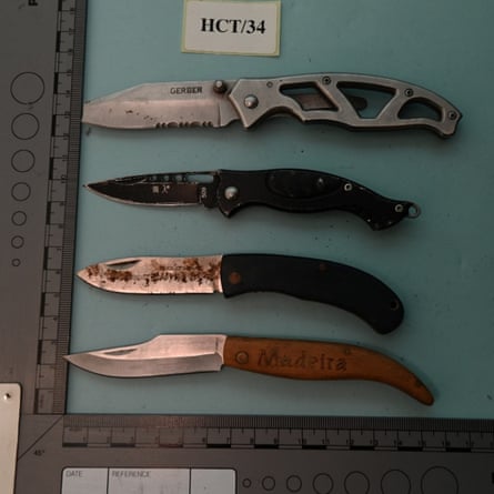Police photo of four hunting knives collected as evidence