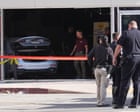 Three dead and six hurt after driver hits cyclist and crashes car into LA grocery store