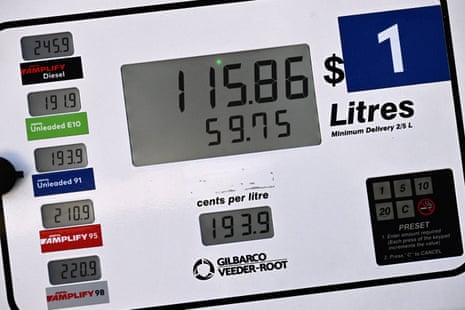 Prices for different petrol grades are shown at a service station in Sydney on 31 July.