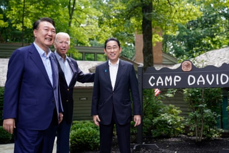South Korea’s President Yoon Suk Yeol, left, President Joe Biden and Japan’s Prime Minister Fumio Kishida, right, meet at Camp David, the presidential retreat, near Thurmont, Md