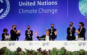 The Cop26 president, Alok Sharma, receives applause after giving the closing speech at Cop26