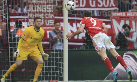 Bayern Munich’s Robert Lewandowski guides a header towards goal in the the Bundesliga match with Darmstadt.