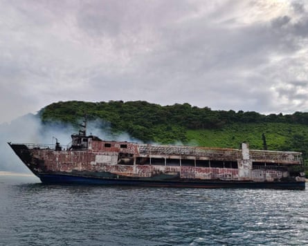 Smoke rising from the burnt passenger ferry M/V June Aster off Palawan province, Philippines, on Thursday