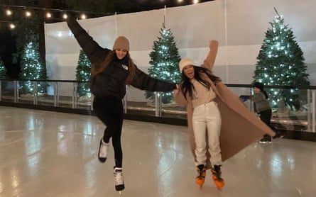 Kendall Jenner, ice skating with sister Kourtney Kardashian, wearing The North Face brown puffer.