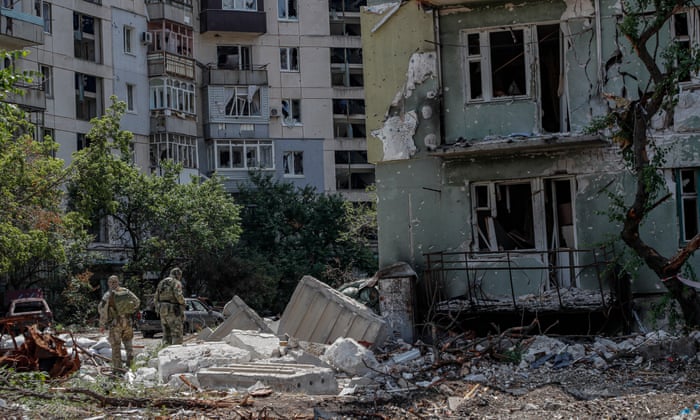 Russian servicemen guard near destroyed apartments building in Sievierodonetsk, Luhansk region, Ukraine.